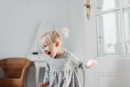 Free Cute Girl in Gray Dress Laughing Stock Photo