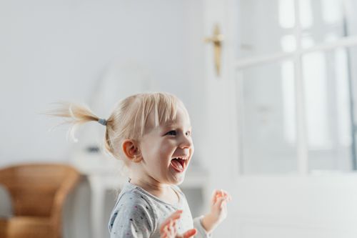Smiling girl playing