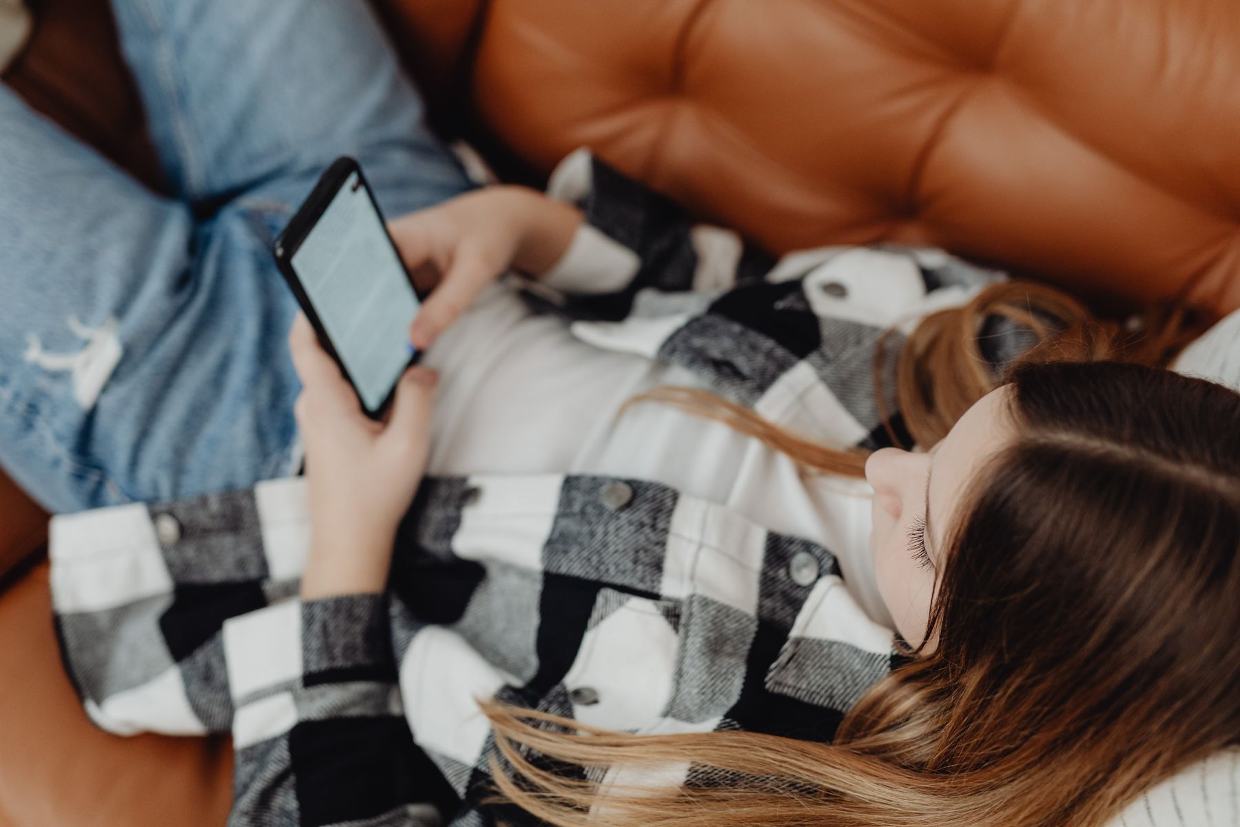 A teenager scrolls on a smartphone. Representational image.