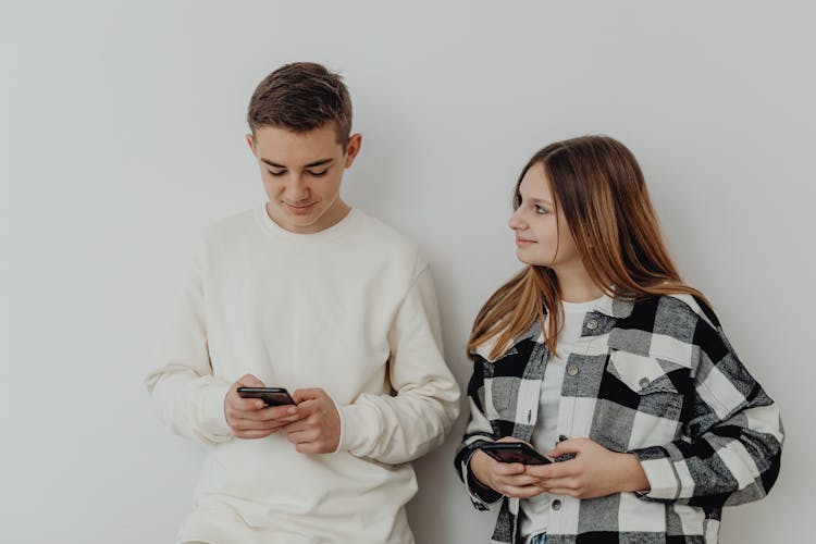 Couple Holding Smartphones