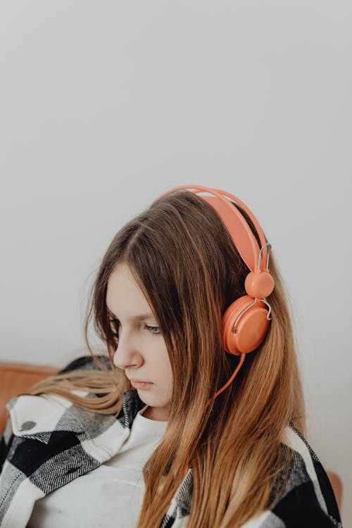 Portrait of a Blonde Girl Wearing Headphones