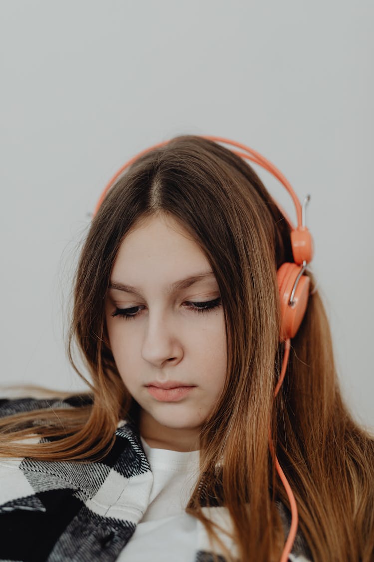 Girl Listening To Music With Headphones