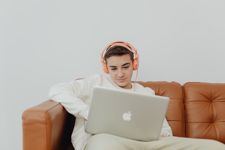 Man With Headphones And Laptop