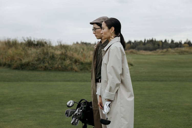 A Man And Woman On The Golf Course 