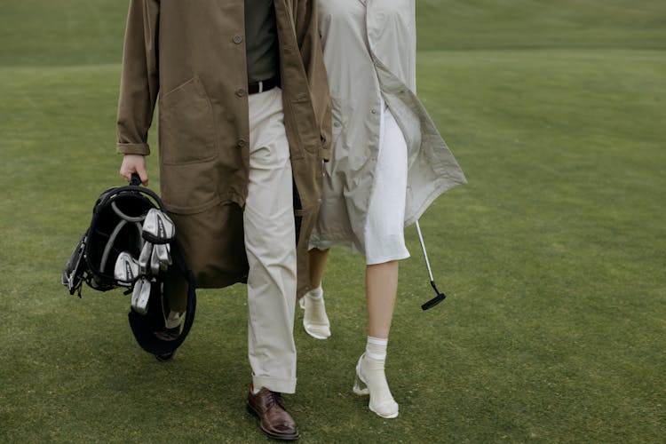 Person Carrying Golf Bag 