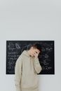 Boy in Beige Hoodie Covering His Face