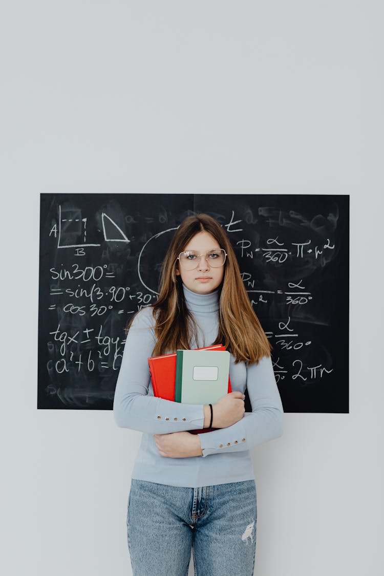 Woman In Front Of Blackboard With Trigonometry Calculations