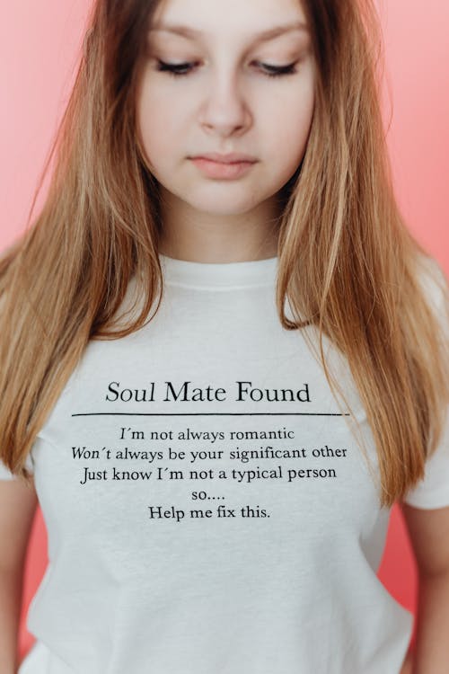 A Girl in a White Shirt with a Printed Message