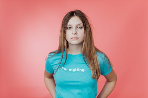 Free A Girl in a Blue Shirt with a Printed Message Stock Photo