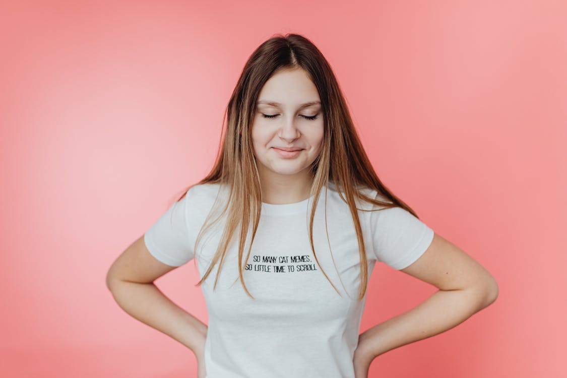 A Girl in a White Shirt with a Printed Message