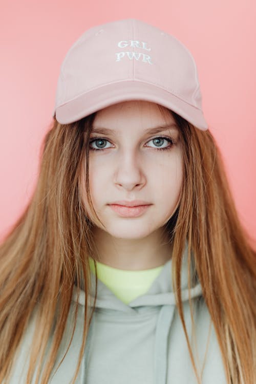 Portrait of a Pretty Girl Wearing a Baseball Cap