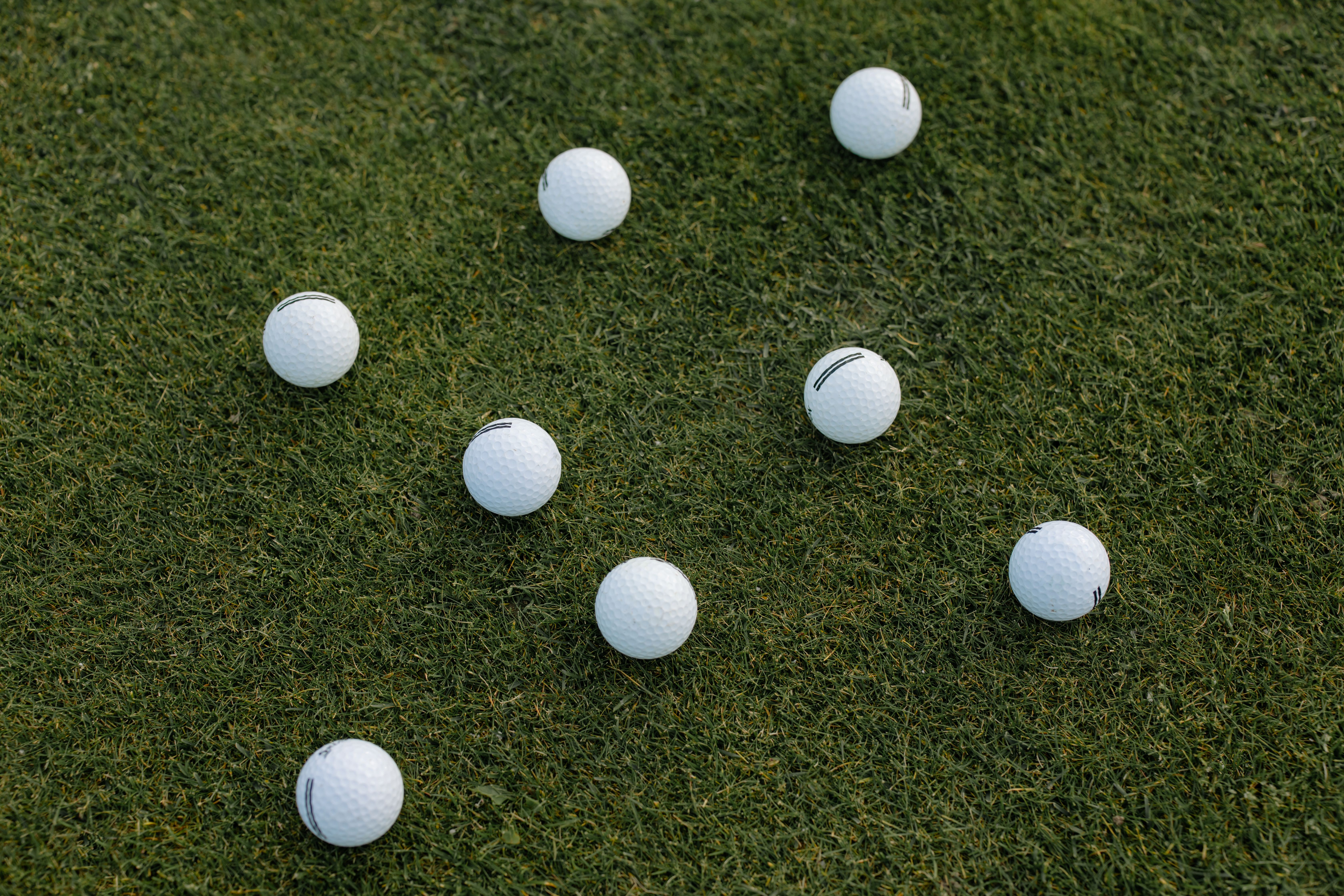 White Golf Ball on Green Grass Field · Free Stock Photo