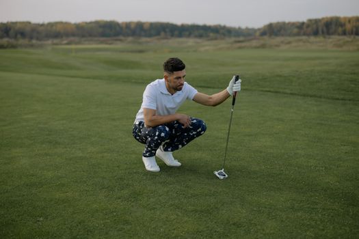 Man in White Shirt Playing Golf