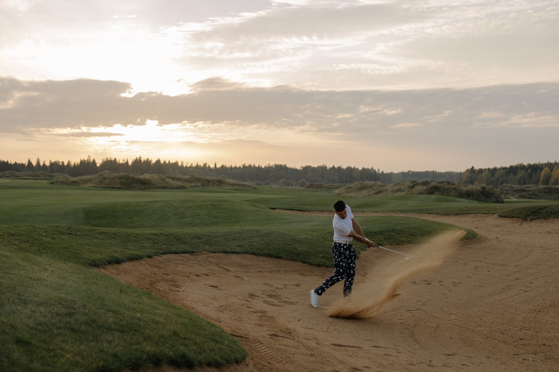 Getting the ball out of the sand is not as easy as it seems. Photo from Pexels.