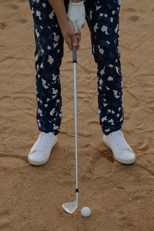 Free A Person Holding a Golf Club Stock Photo