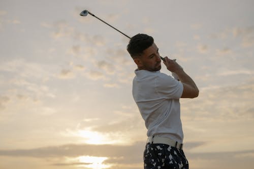 A Man Holding a Golf Club