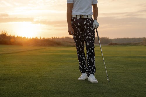 Free A Man Holding a Golf Club Stock Photo