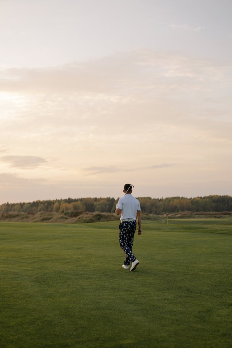 Photo Of Golfer Holding A Golf Club