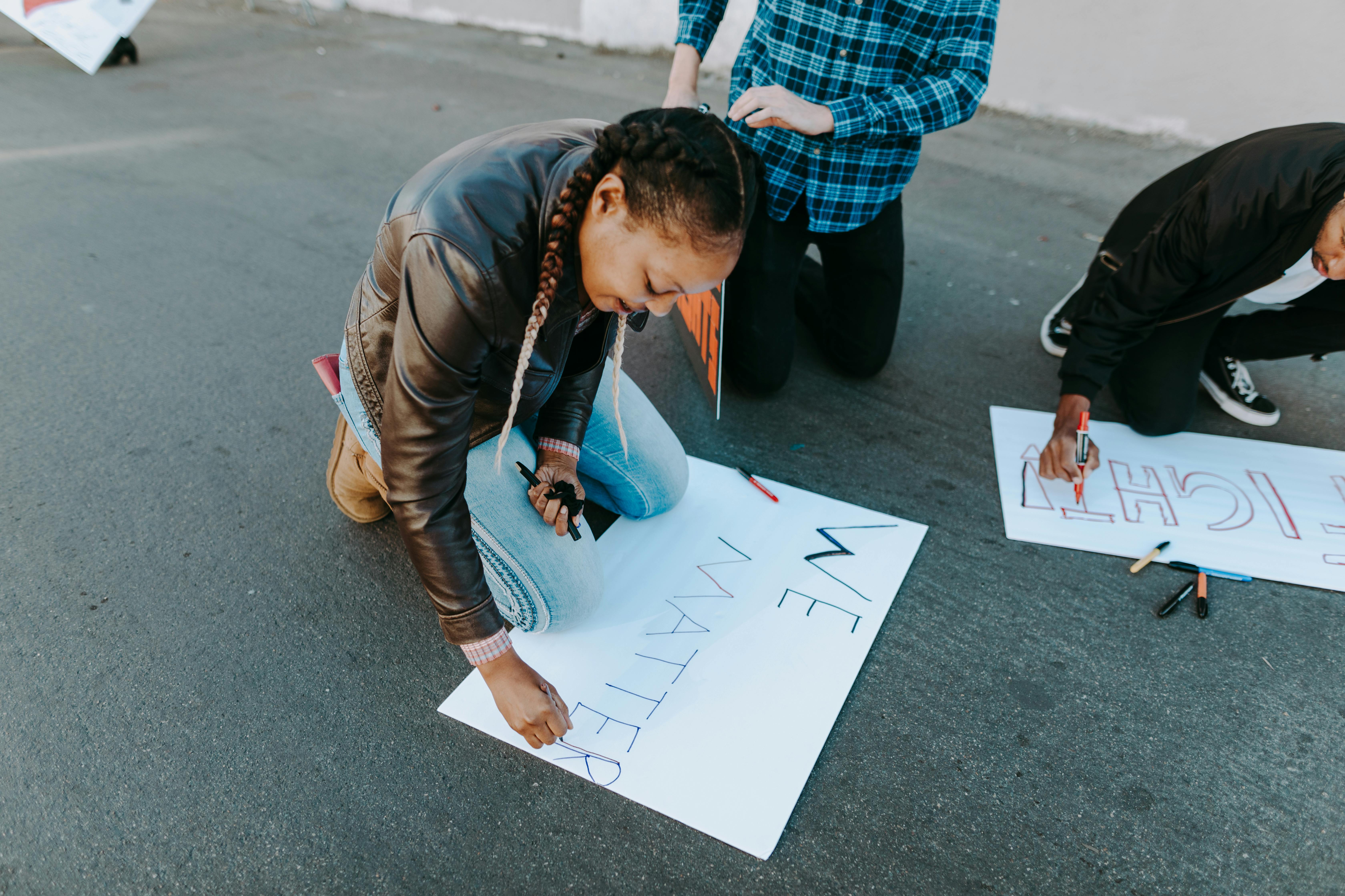 man in brown jacket holding white printer paper