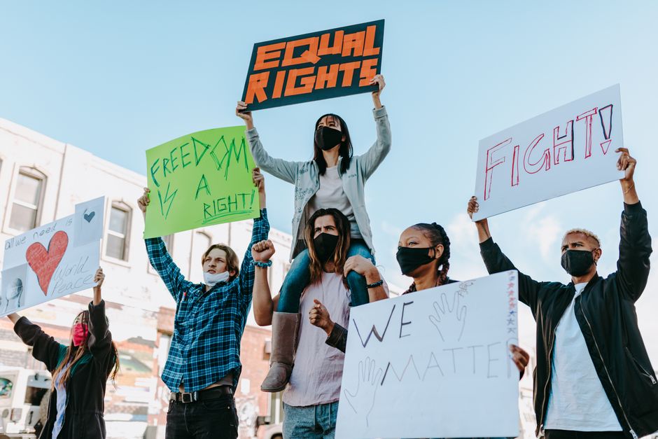 students holding protest signs