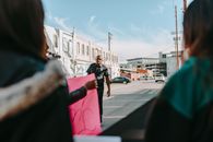 Woman in Black Shirt and Black Pants Standing on Sidewalk