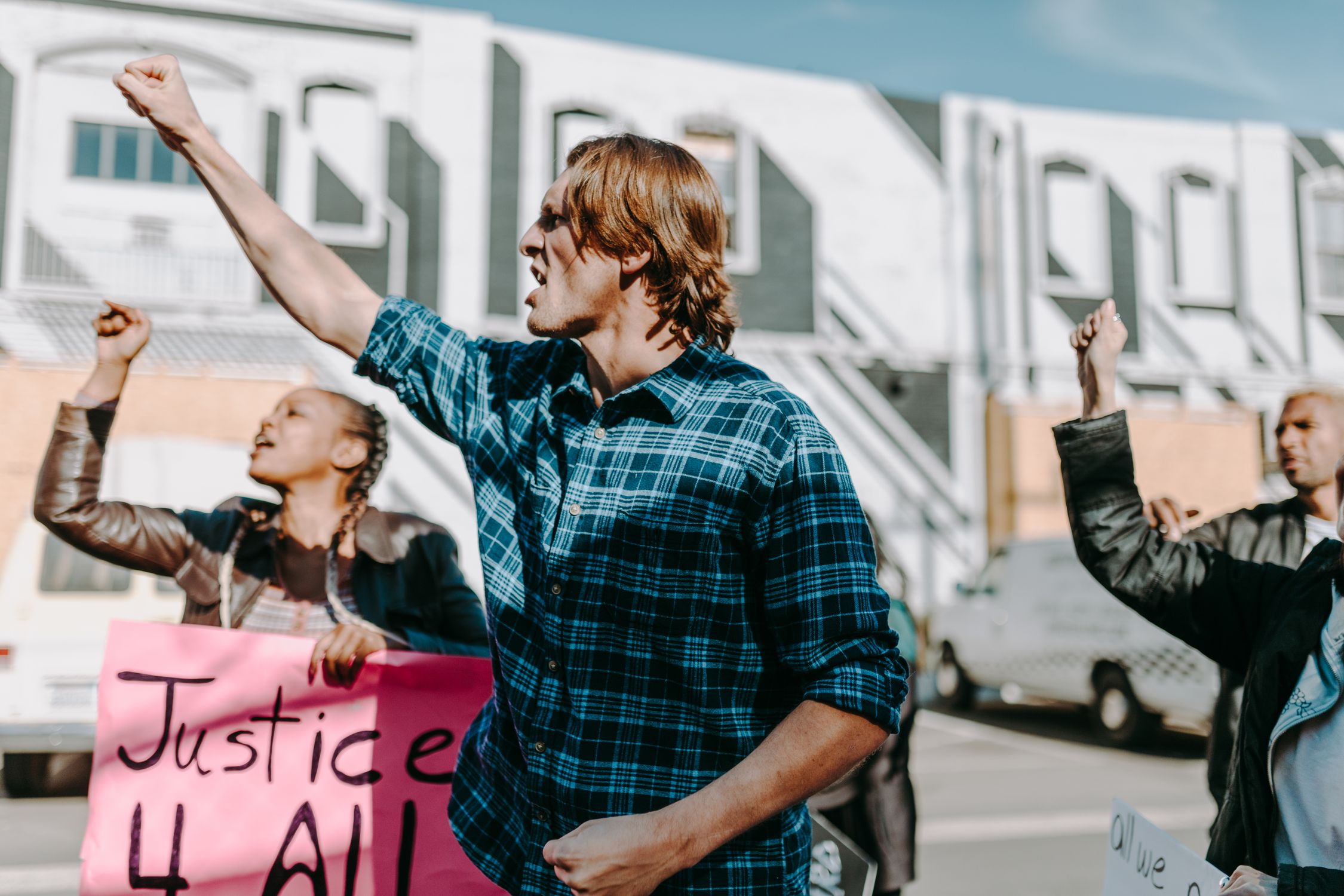 Verbal Rally Rallyists Holding Banners while Shouting on the Street · Free Stock Photo