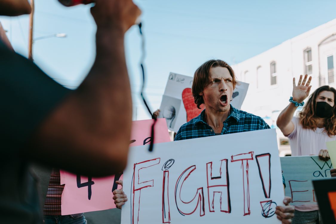 A Man Holding Placard doing Protesting · Free Stock Photo
