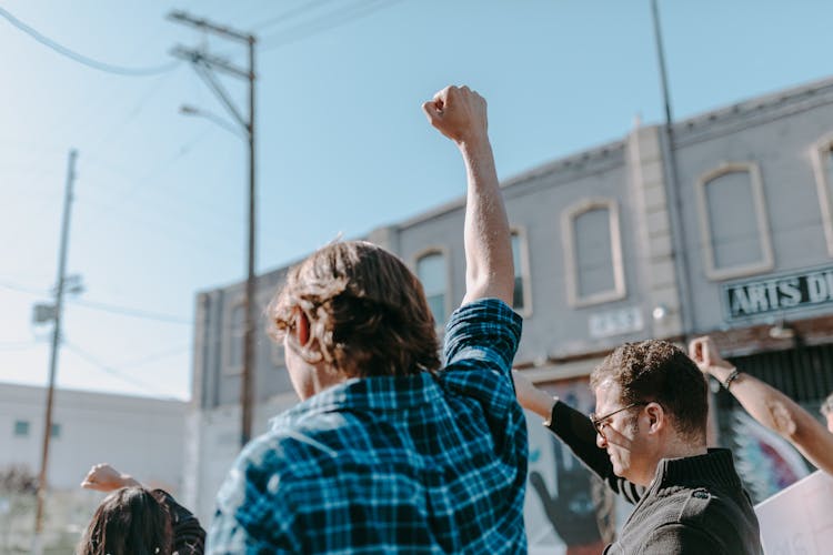 A Person Raising His Hand 