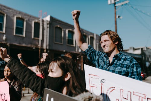 Free A Man Holding Placard Doing Demonstration Stock Photo