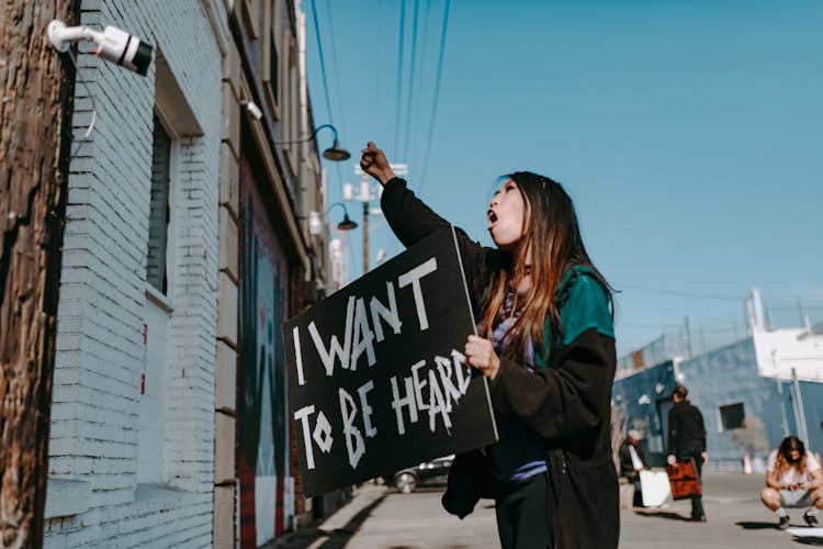 A Woman Holding Placard 