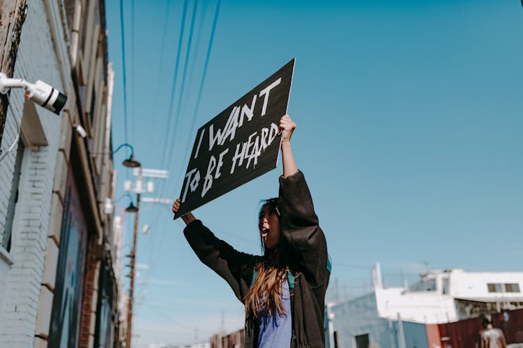 A Woman Holding Placard 