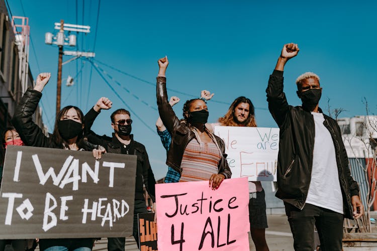 People Holding Protest Banners