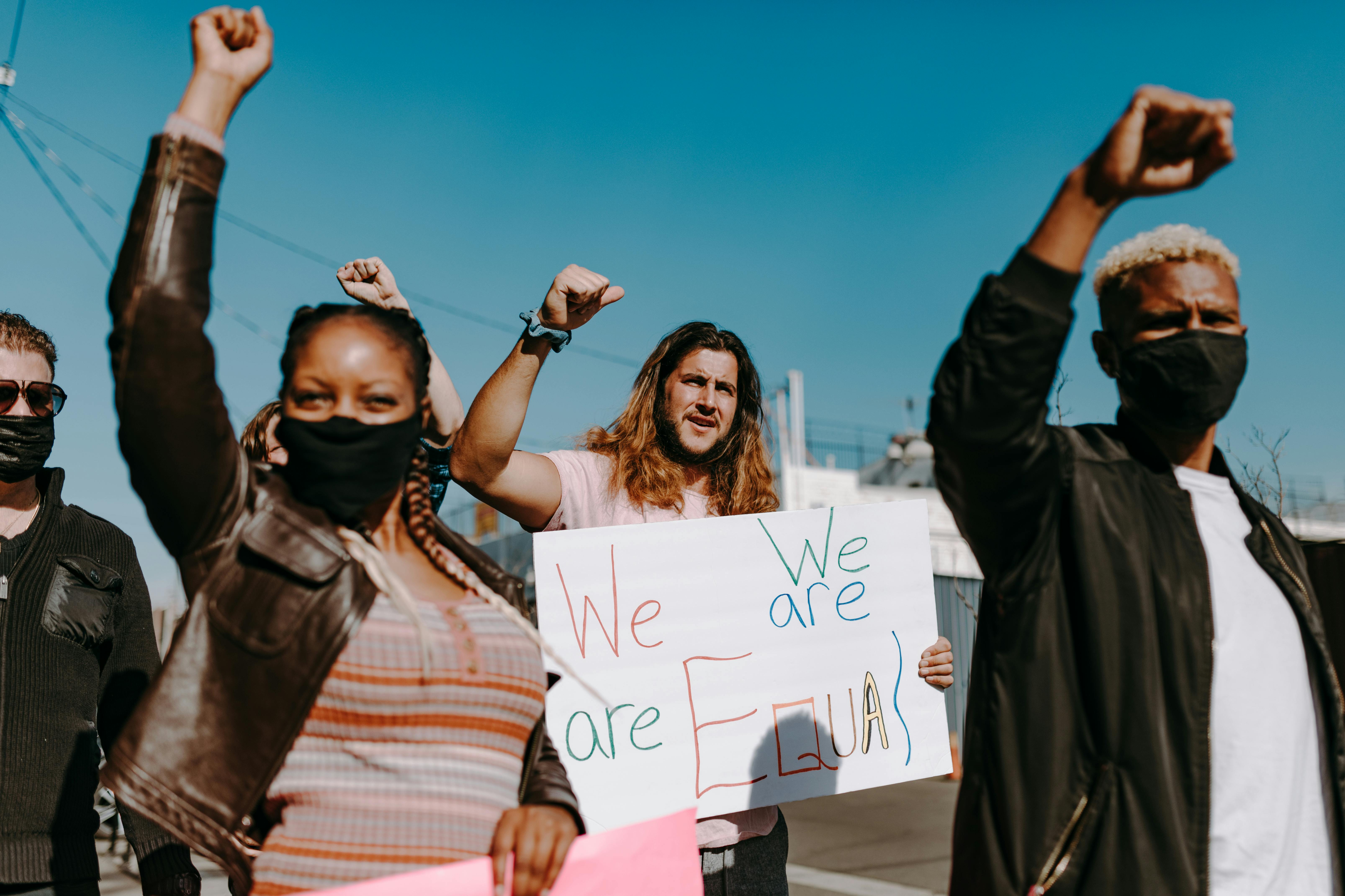 people holding protest banners