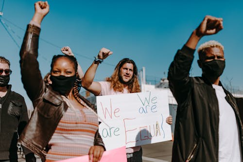 People Holding Protest Banners