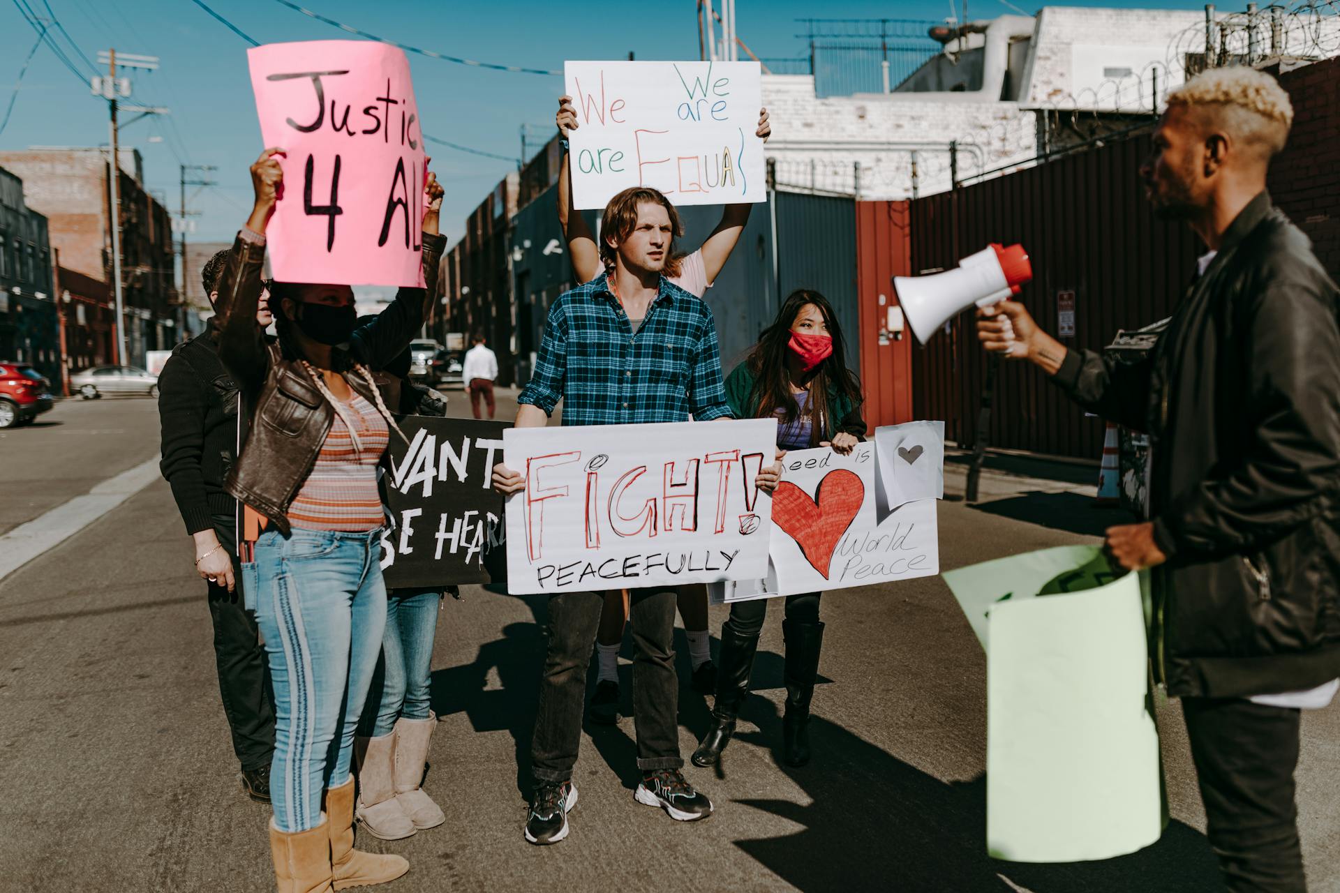 People Holding Protest Banners