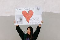 A Woman Holding a Protest Banner