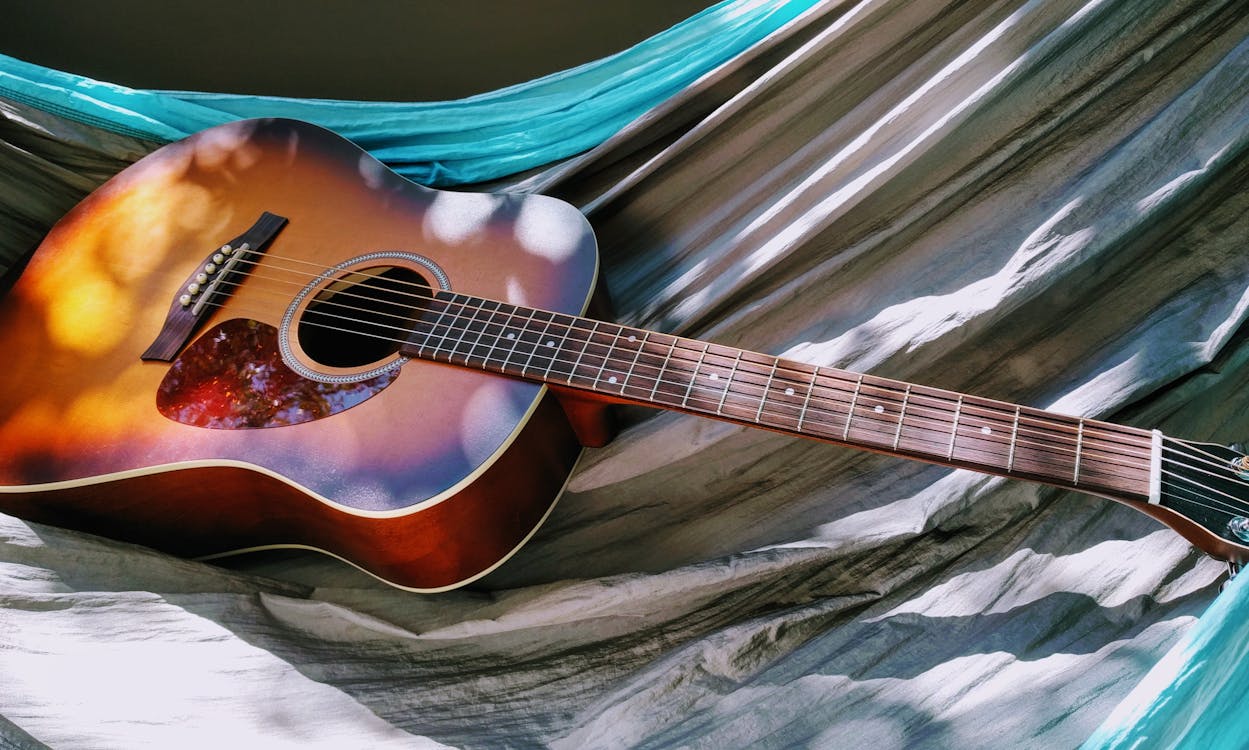 Free Acoustic Guitar on Hammock Stock Photo