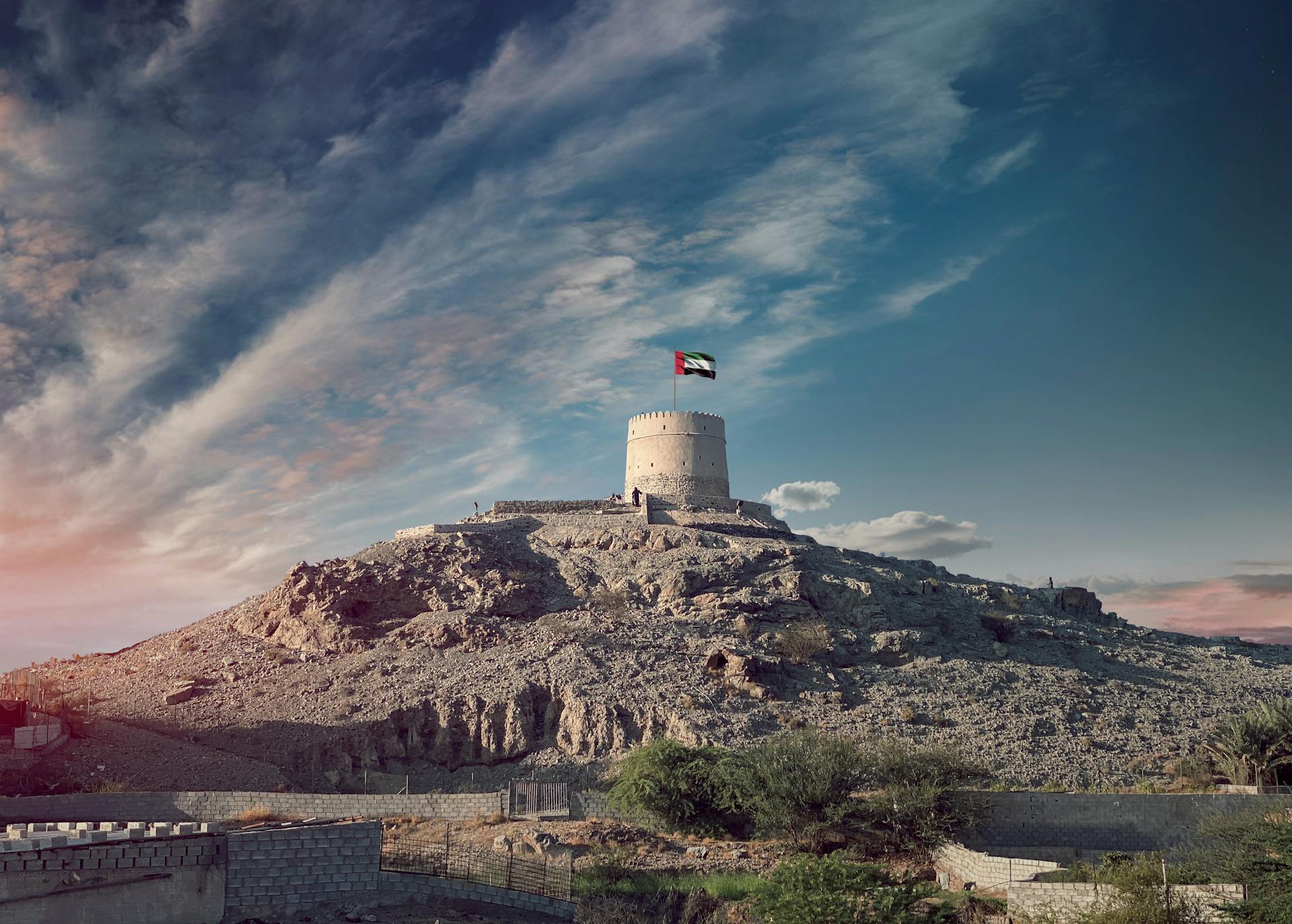 Tower with Flag under Cloudscape, Sharjah, United Arab Emirates