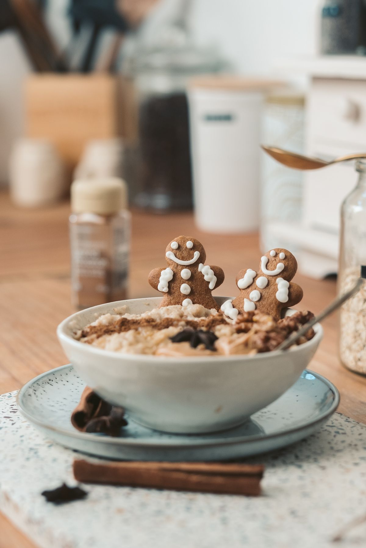 Festive Christmas breakfast bowl with gingerbread cookies oatmeal and cinnamon sticks