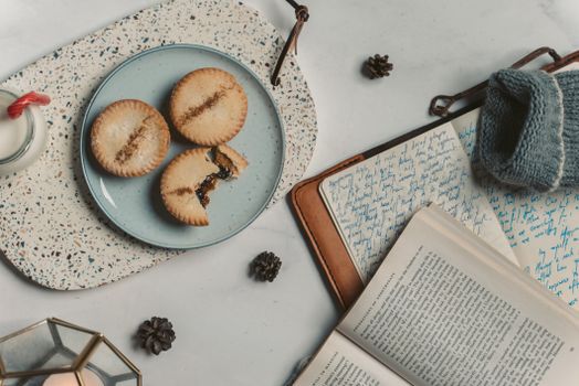 A cozy scene with cookies and journals, perfect for winter reading and relaxation.