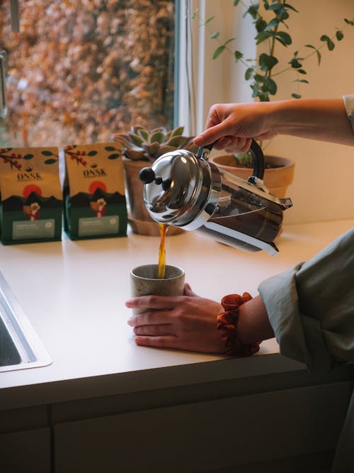 Free Person Pouring Coffee on Cup Stock Photo