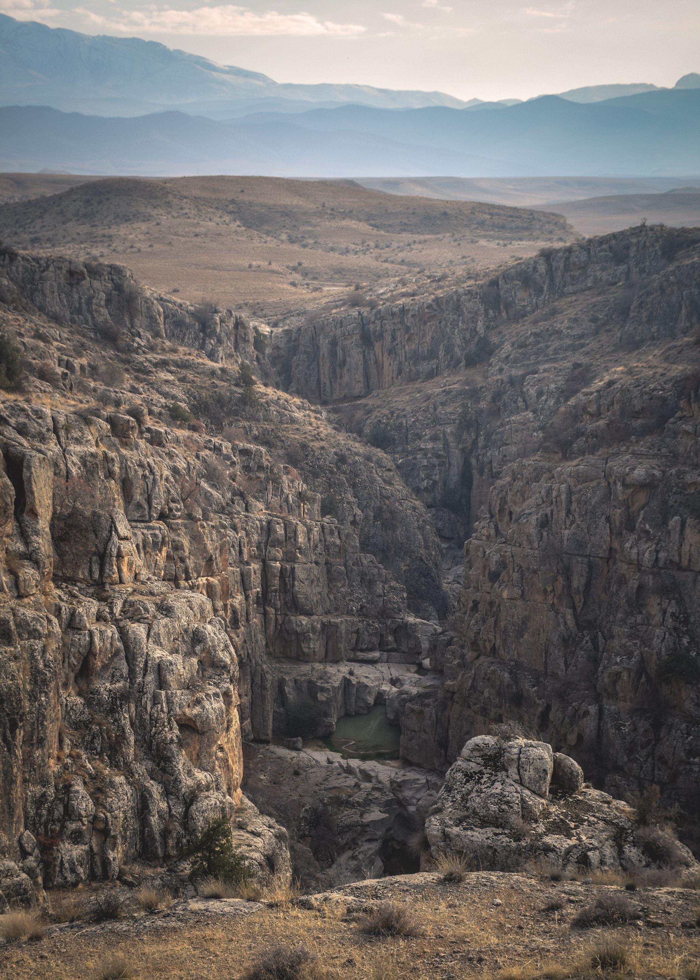 Stunning canyon landscape in Tehran displays rugged geological formations and vast vistas.