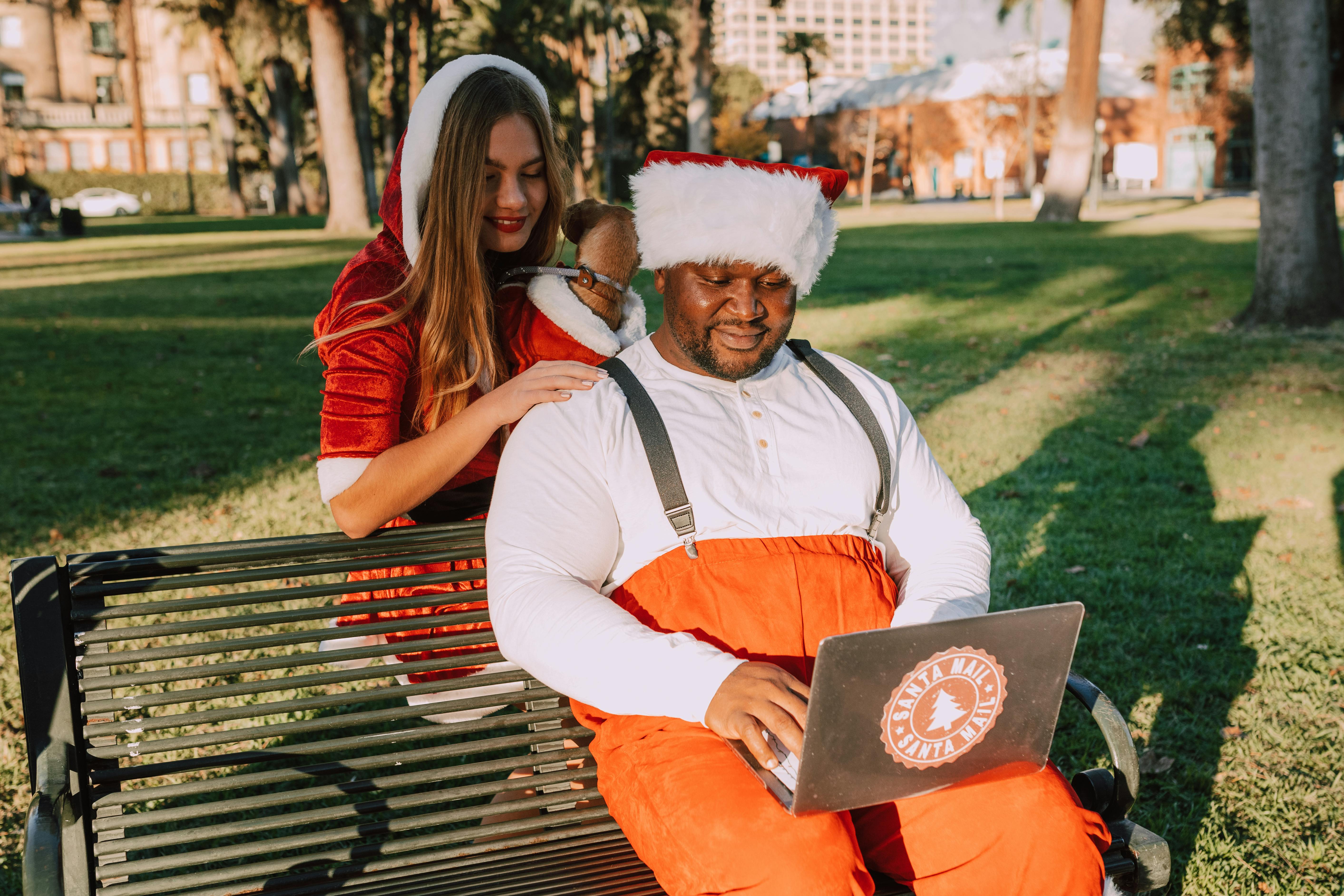 man in white long sleeve shirt sitting beside woman in red jacket