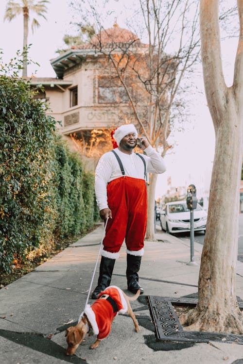 A Man Talking on the Phone while on the Street