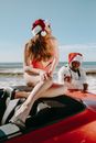 Woman in White Long Sleeve Shirt Sitting on Red and White Boat on Sea