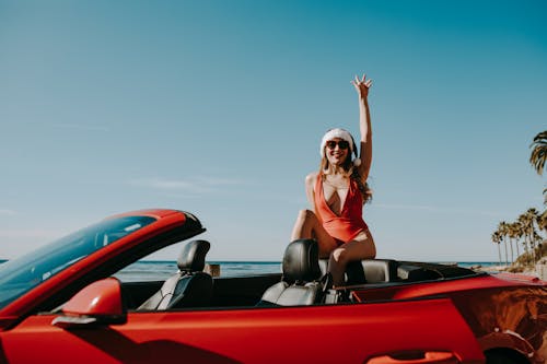 Woman in Red Sports Car