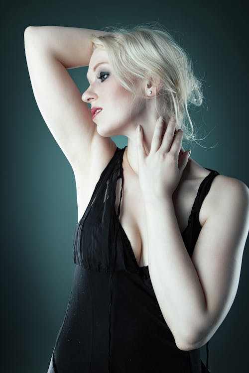Free A Woman with Blond Hair Wearing Bodysuit Stock Photo