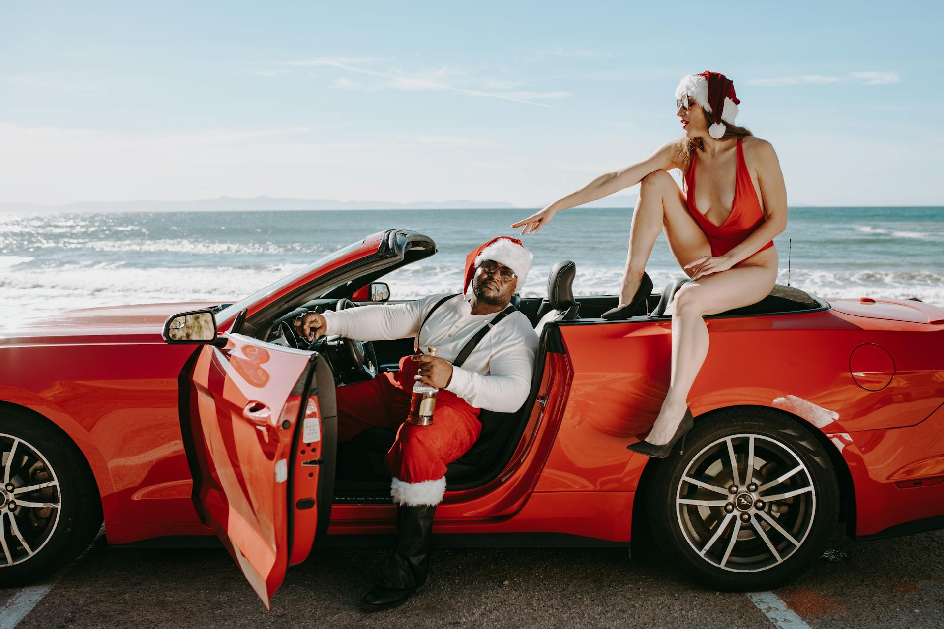 Woman in Red Bikini Sitting on Red Convertible Car