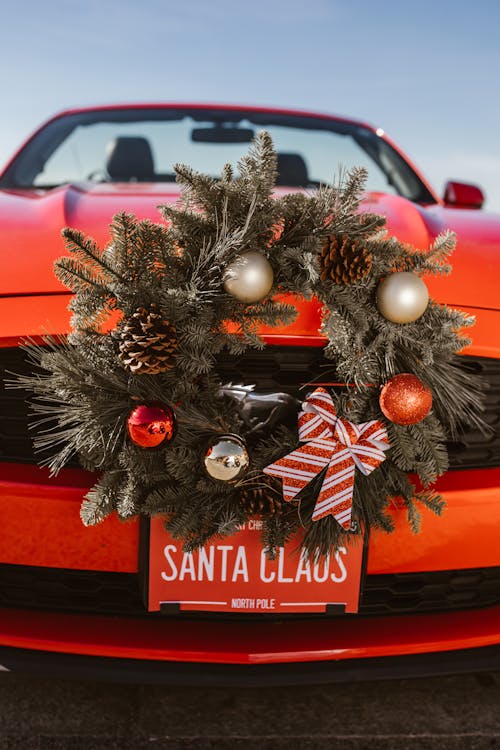 Red Car With Silver and Gold Christmas Wreath