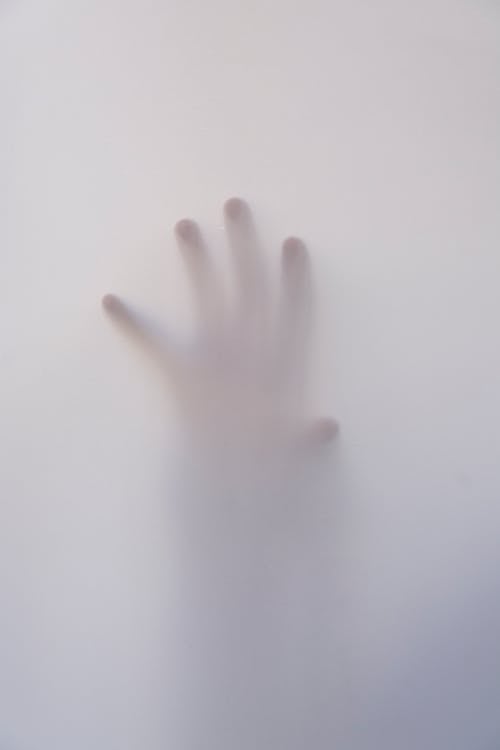 Free Person's Hand Touching Wall Stock Photo